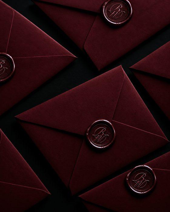 Burgundy wax-sealed envelopes